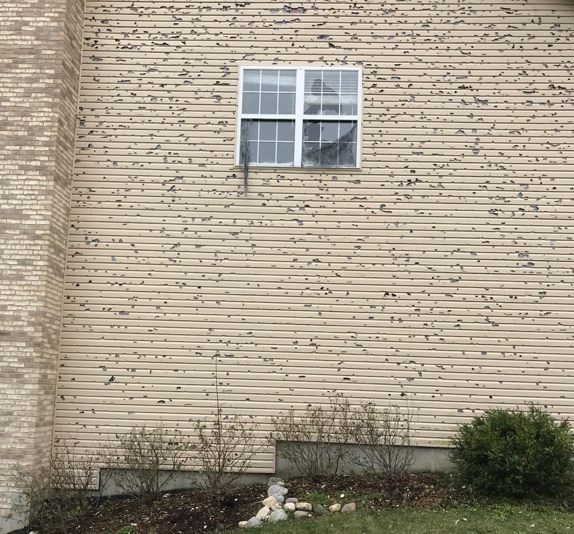 Window in a Siding of a House — Mundelein, IL — Suburban Roofing & Siding