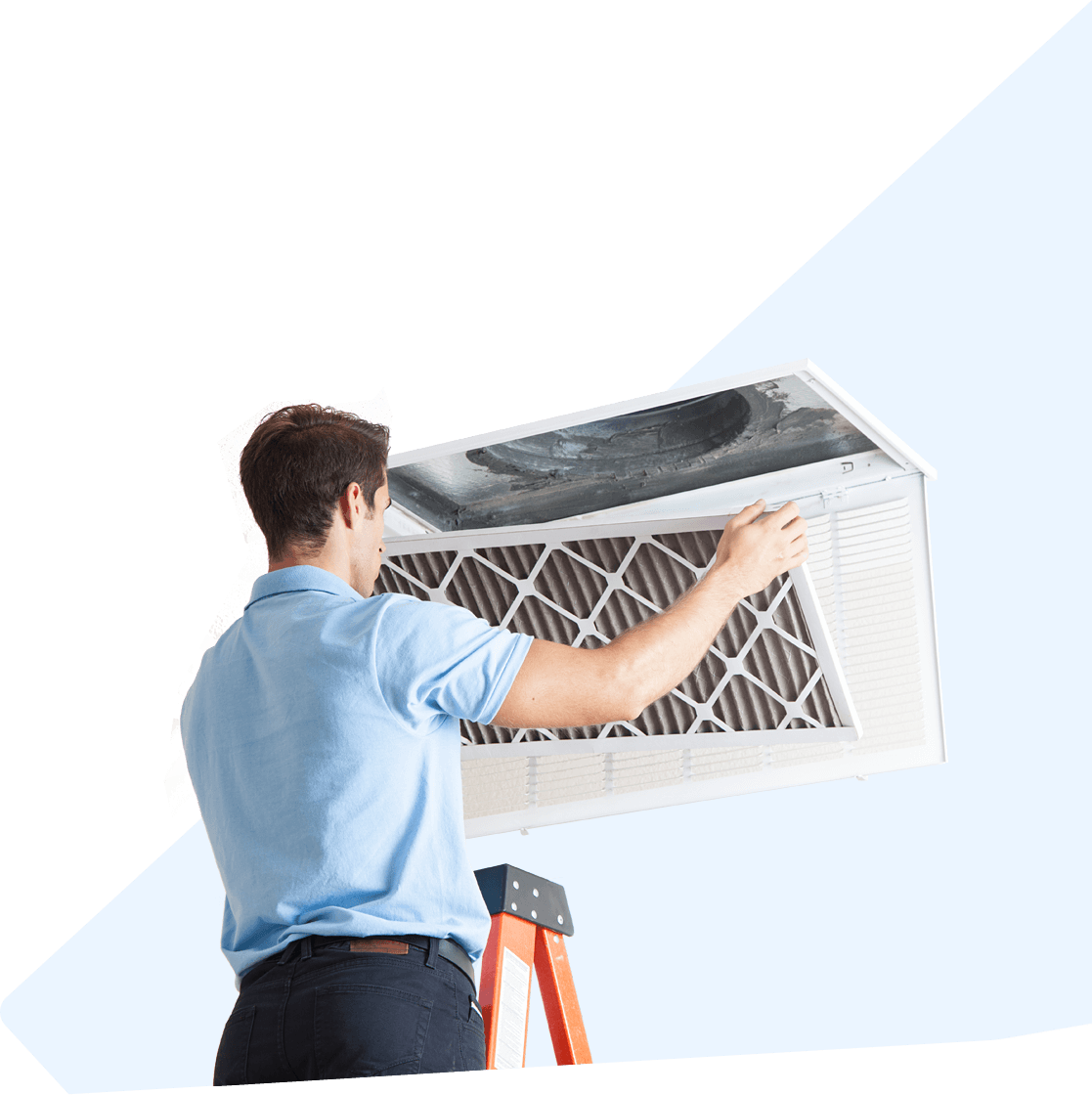 A man is standing on a ladder cleaning an air filter.