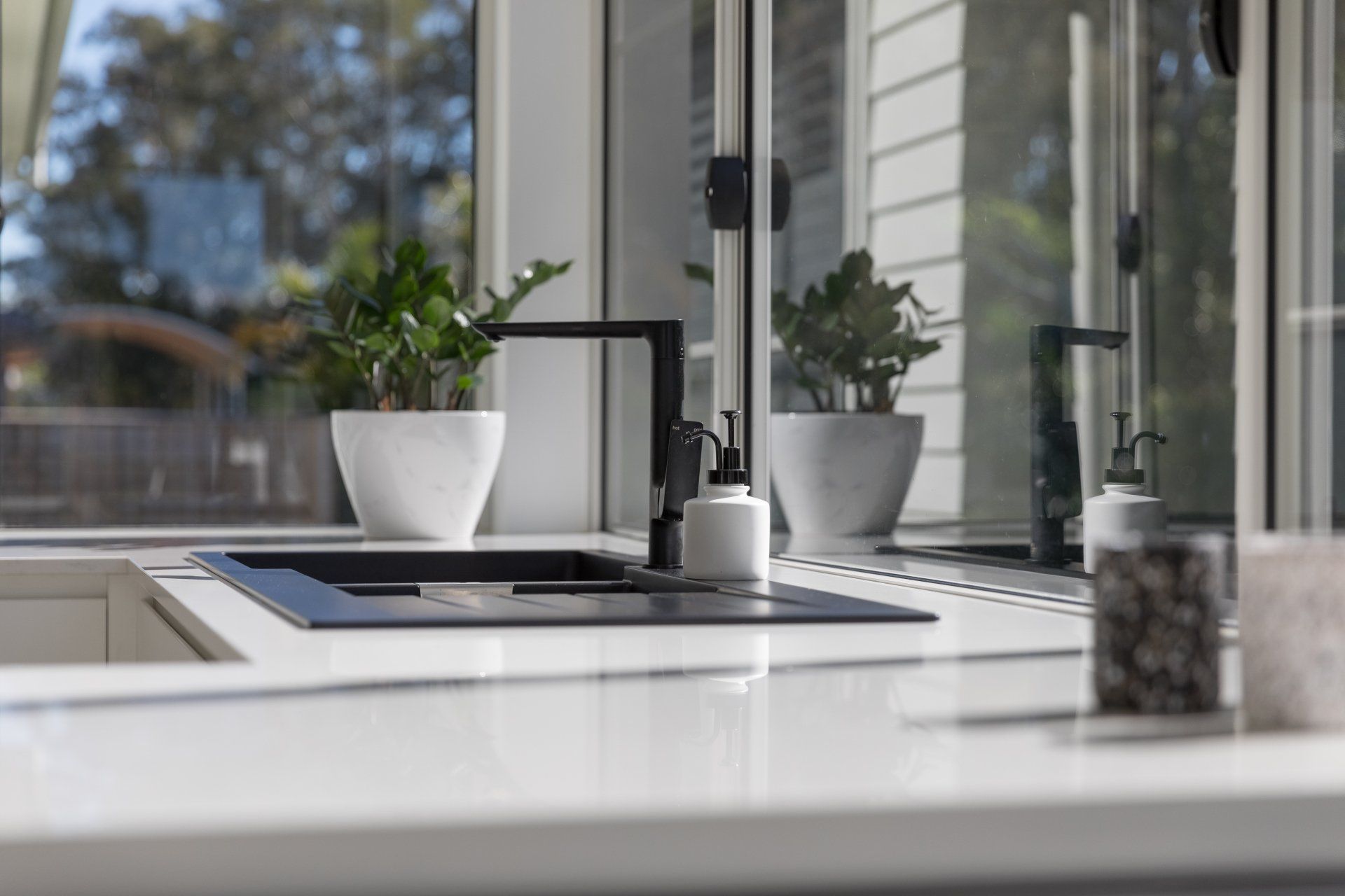 Black Kitchen Sink And Tap — Platinum Kitchens & Bathrooms In Coffs Harbour NSW