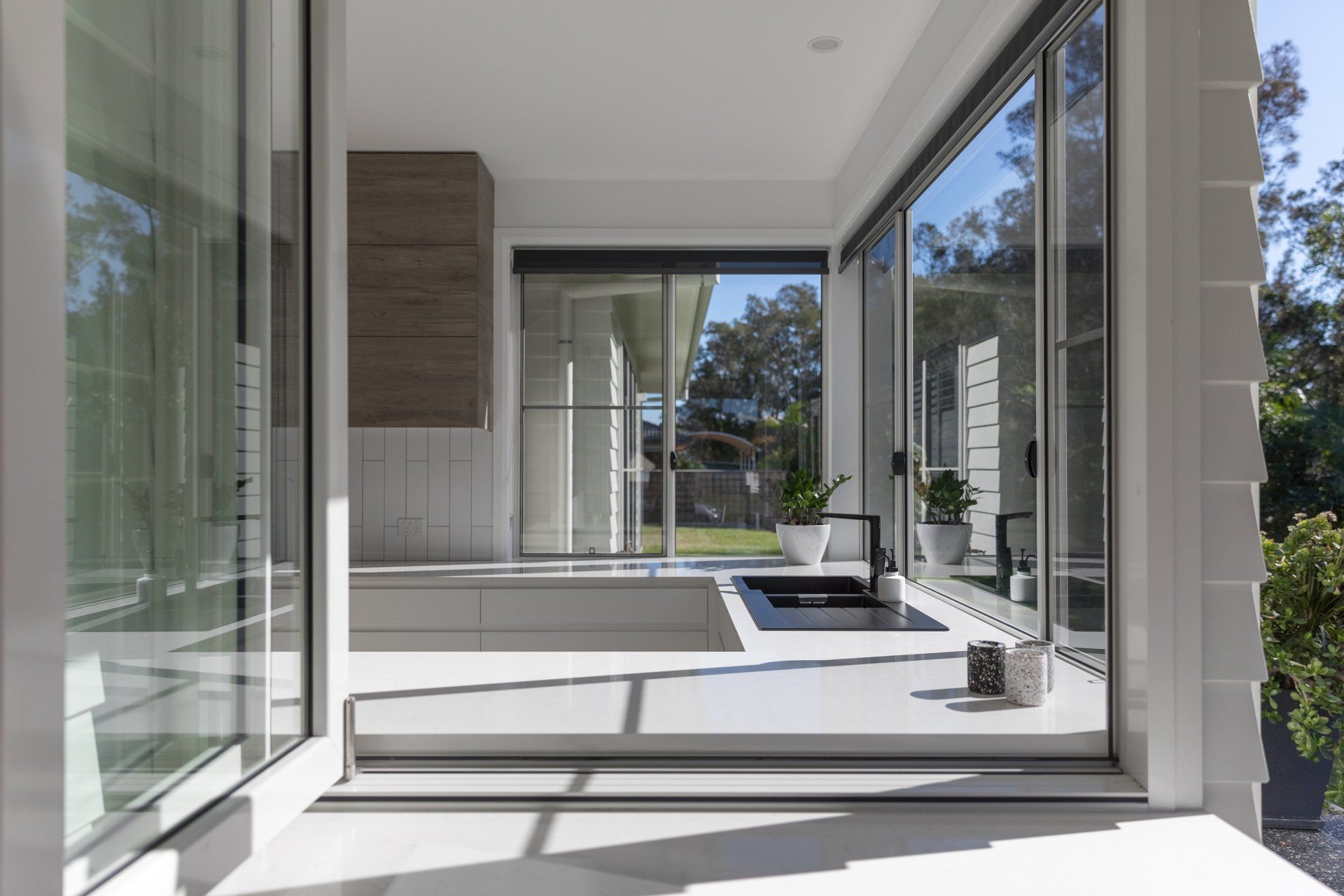 Modern Kitchen with Large Windows — Platinum Kitchens & Bathrooms In Coffs Harbour NSW