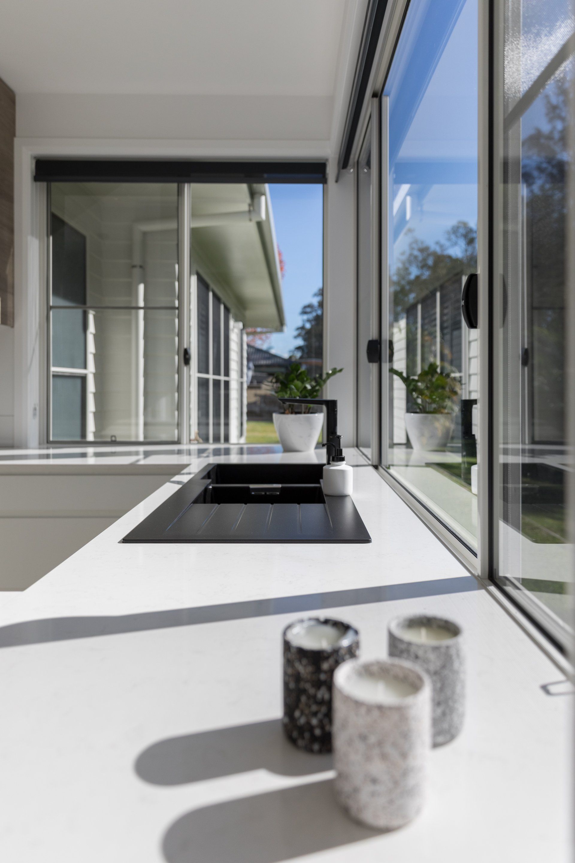 Modern Black Sink in Kitchen — Platinum Kitchens & Bathrooms In Coffs Harbour NSW