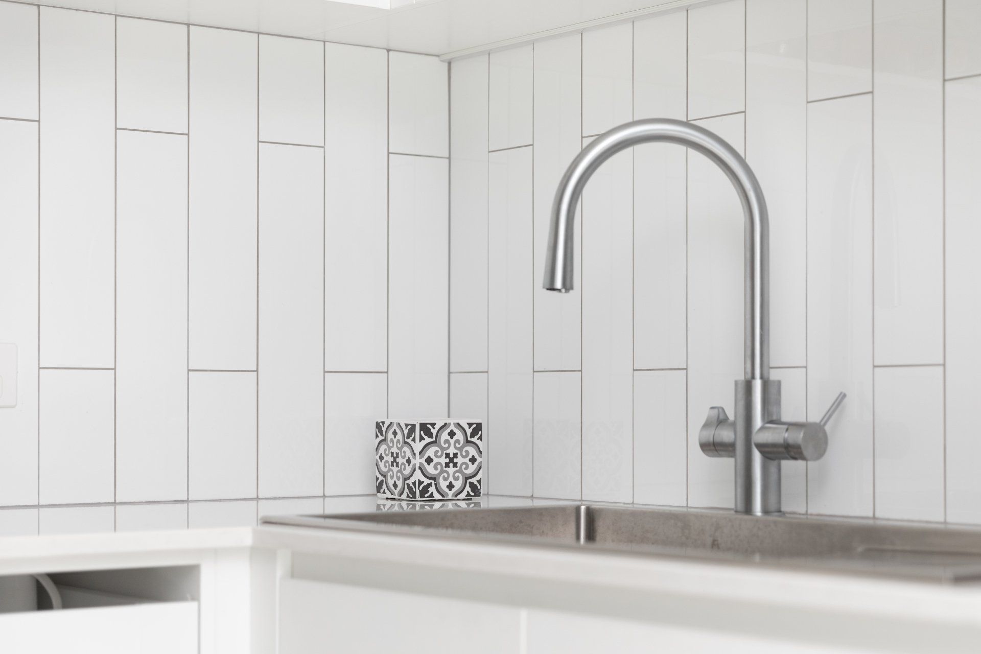 White Tiled Splashback with Sink — Platinum Kitchens & Bathrooms In Coffs Harbour NSW