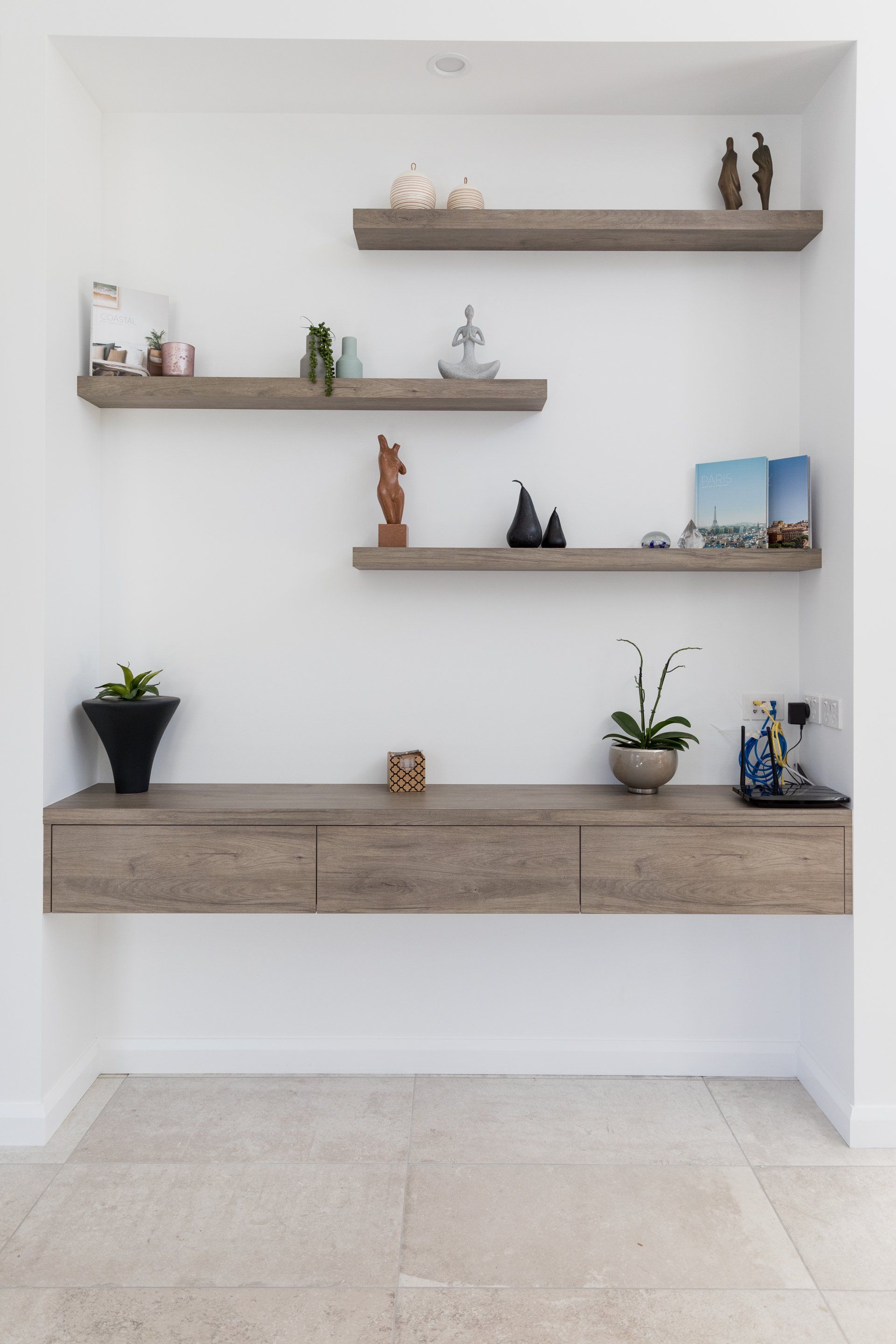 Wooden Shelves With Houseplants And Figurines — Platinum Kitchens & Bathrooms In Coffs Harbour NSW