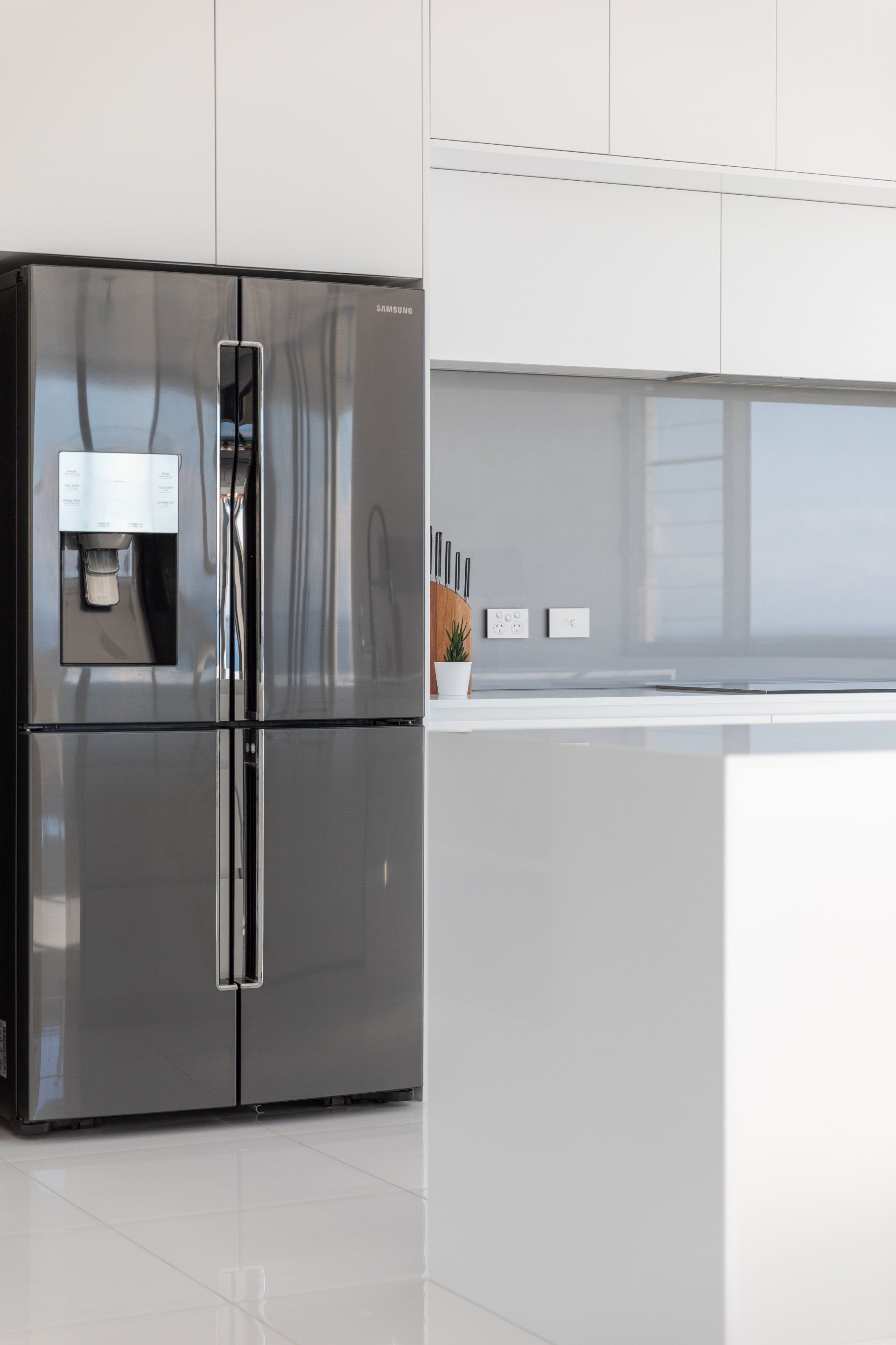 French Door Refrigerator In Modern Kitchen— Platinum Kitchens & Bathrooms In Coffs Harbour NSW