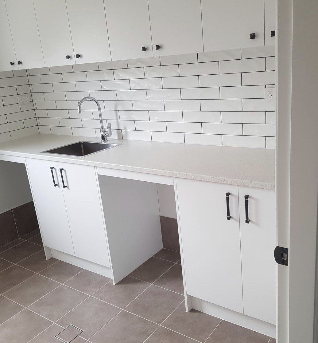 Laundry With Subway Tile — Platinum Kitchens & Bathrooms In Coffs Harbour NSW
