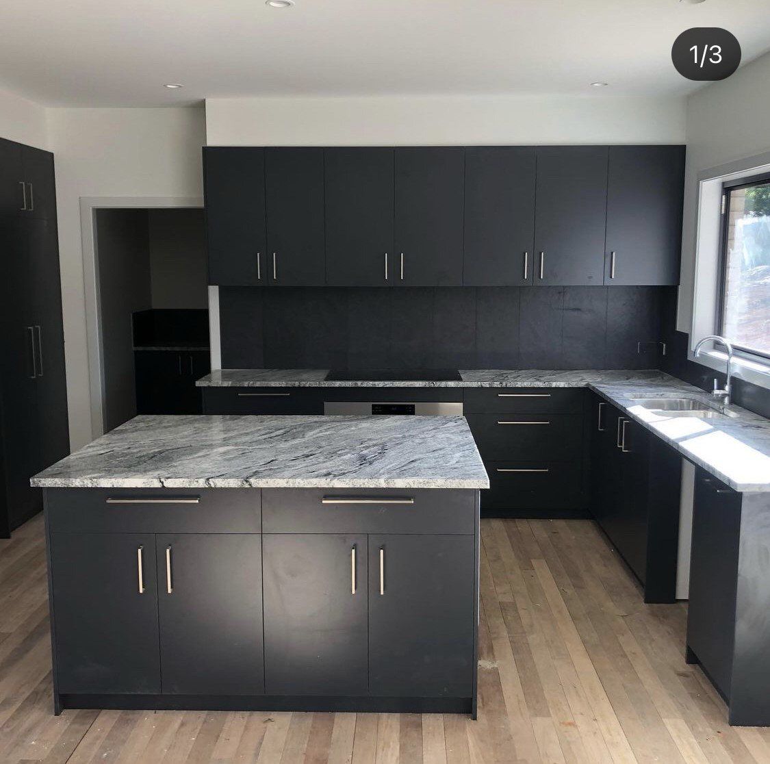Kitchen With Black Cabinets — Platinum Kitchens & Bathrooms In Coffs Harbour NSW