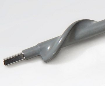 A close up of a gray screw with a metal end on a white surface.  rothgreaves ptfe coatings