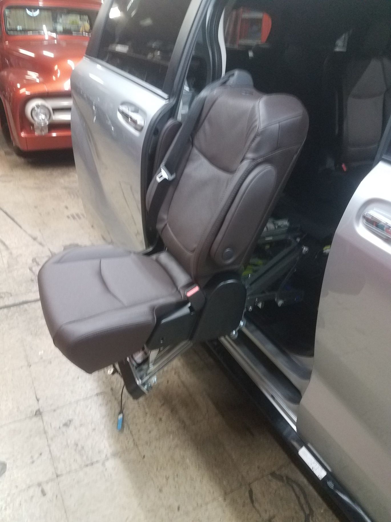 The back seat of a car with the door open