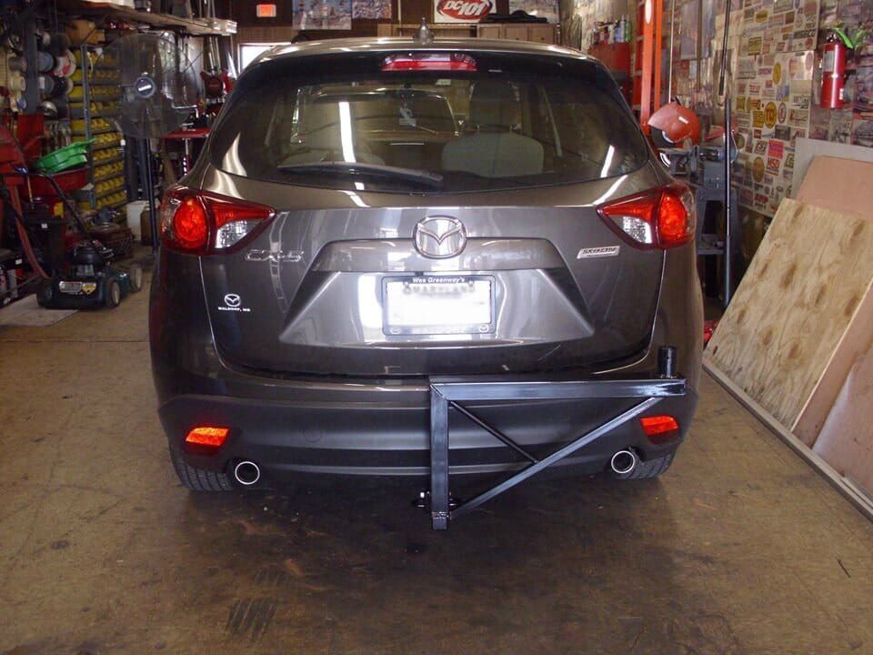 A mazda cx-5 is parked in a garage