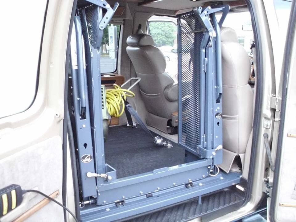 The inside of a van with a handicap lift in it