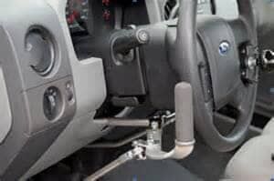 A close up of a steering wheel in a car.