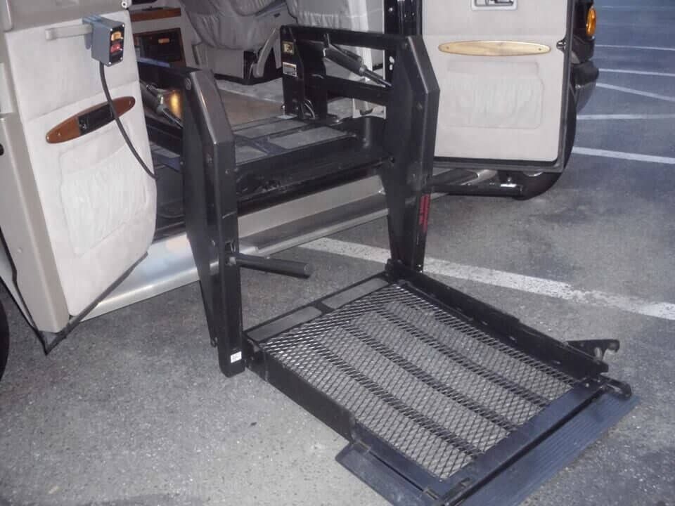 A van with a wheelchair ramp attached to it