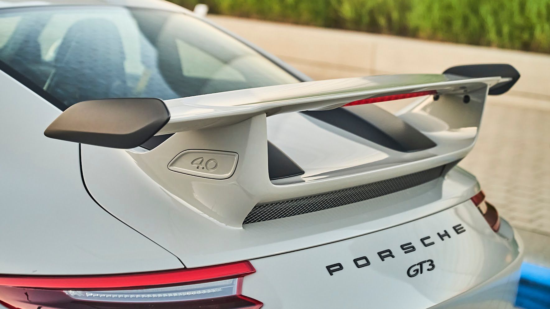 A porsche gt3 is parked on the side of the road