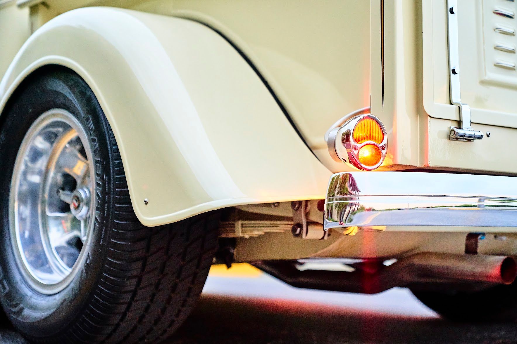 A close up of a car 's wheel and fender
