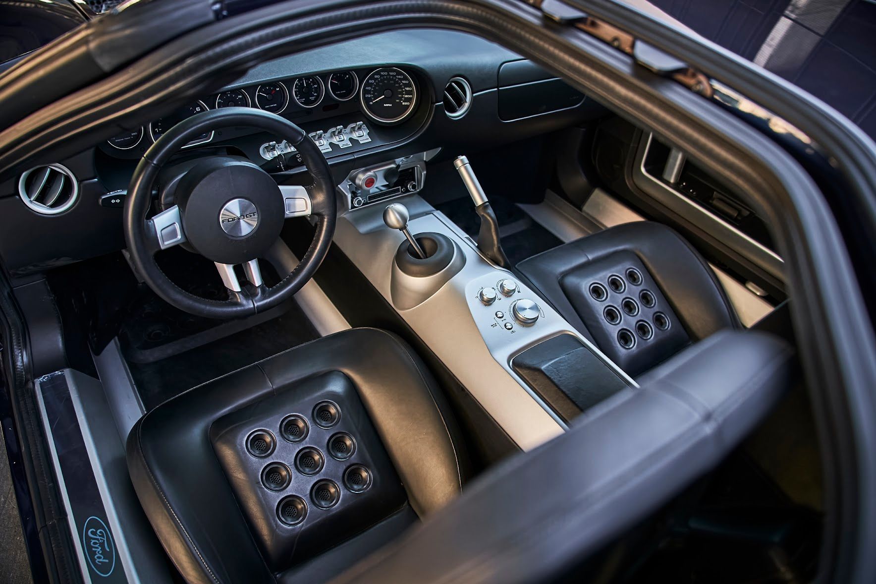 The interior of a ford car with the door open