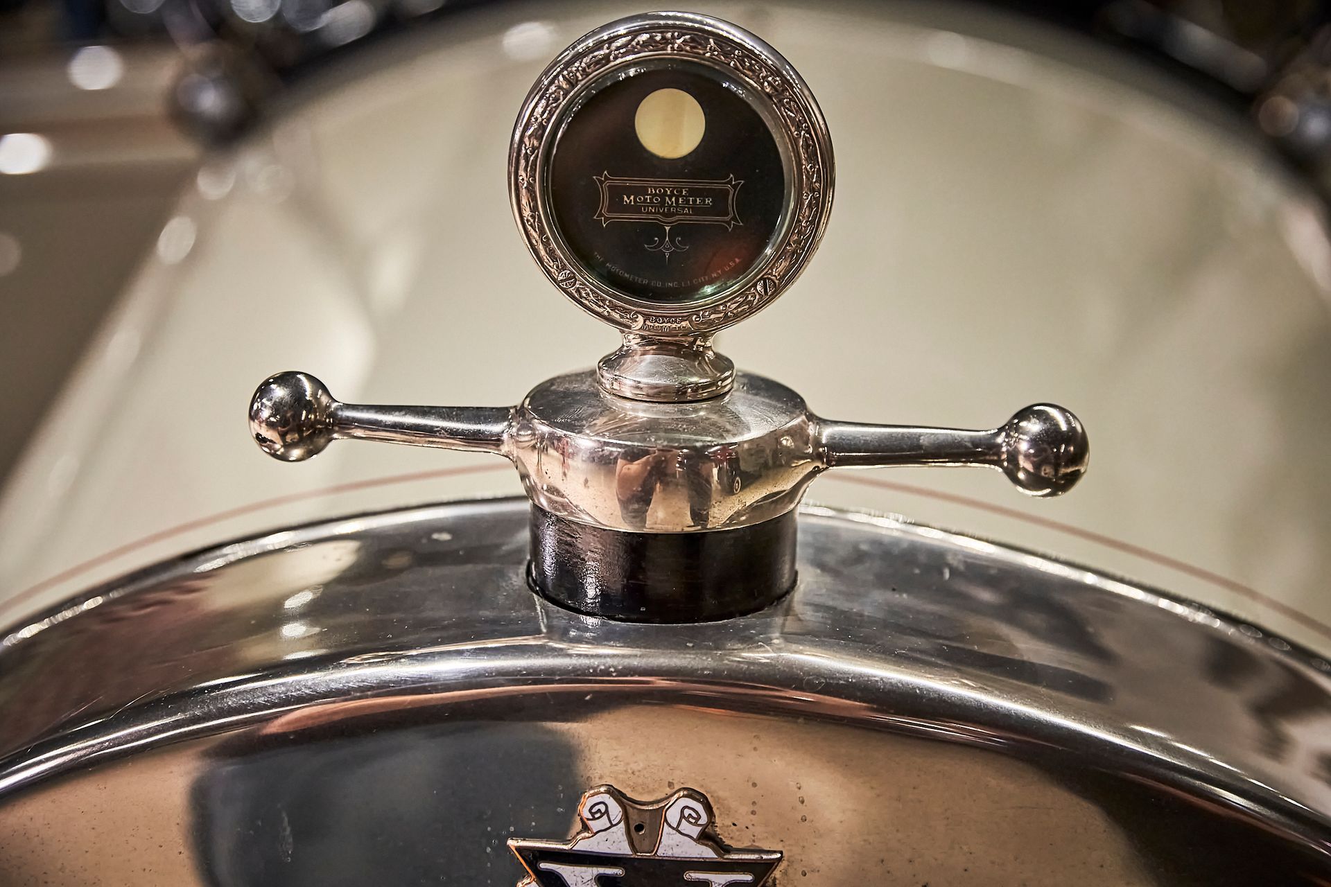 A close up of a hood ornament on a car