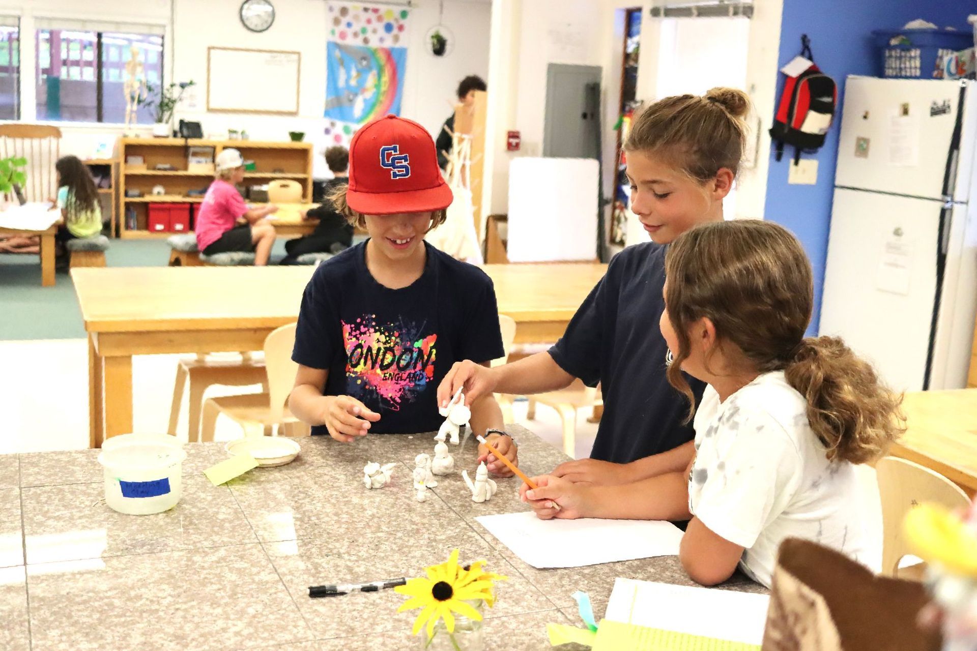 Montessori children are laying in a tent