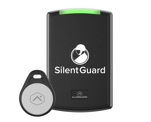 A silent guard device with a key fob next to it