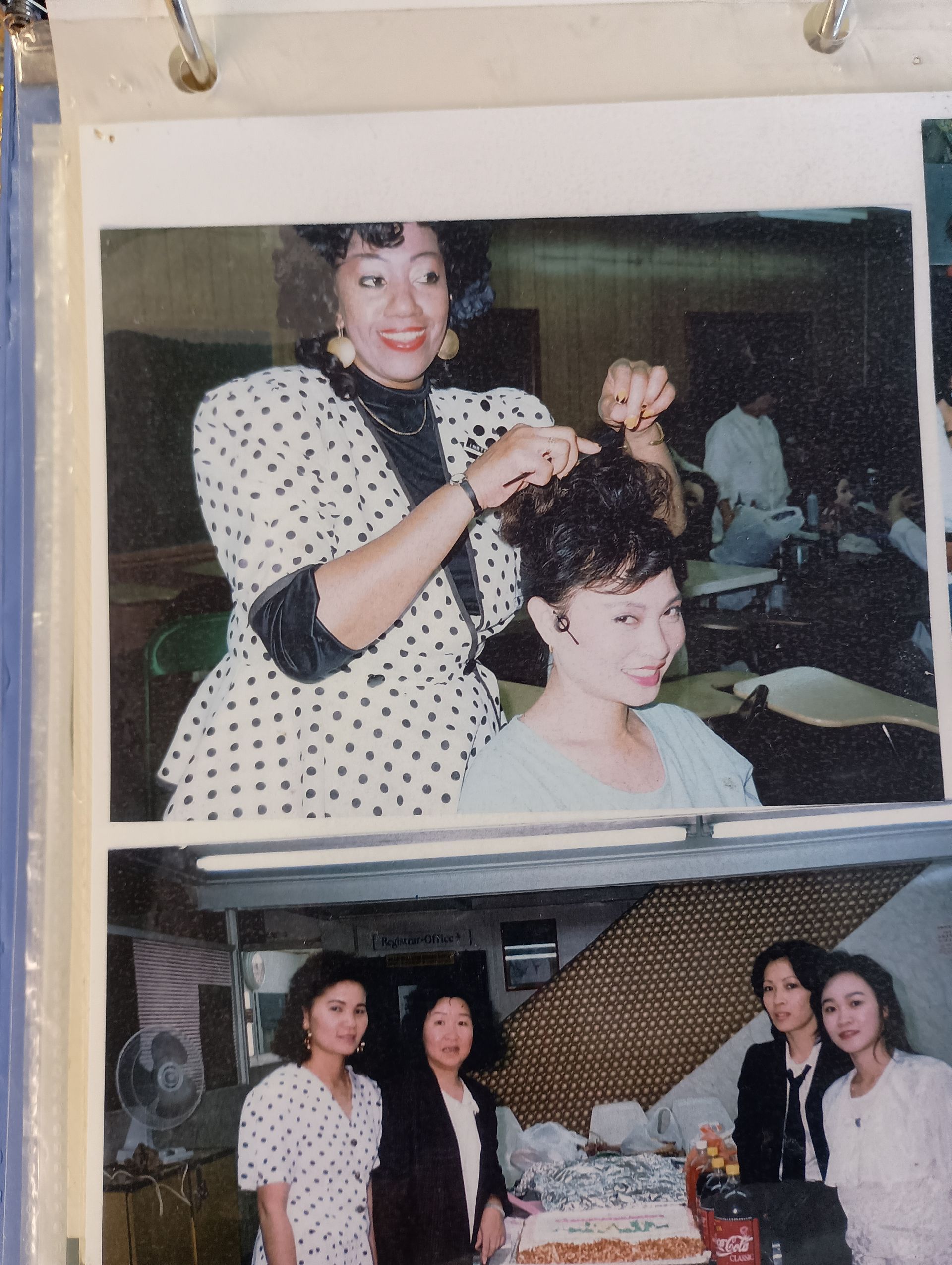A woman in a polka dot dress is getting her hair done