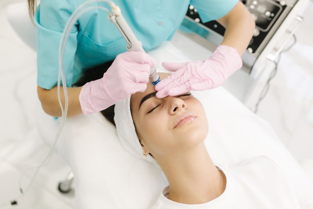 A woman is getting a facial treatment in a beauty salon.