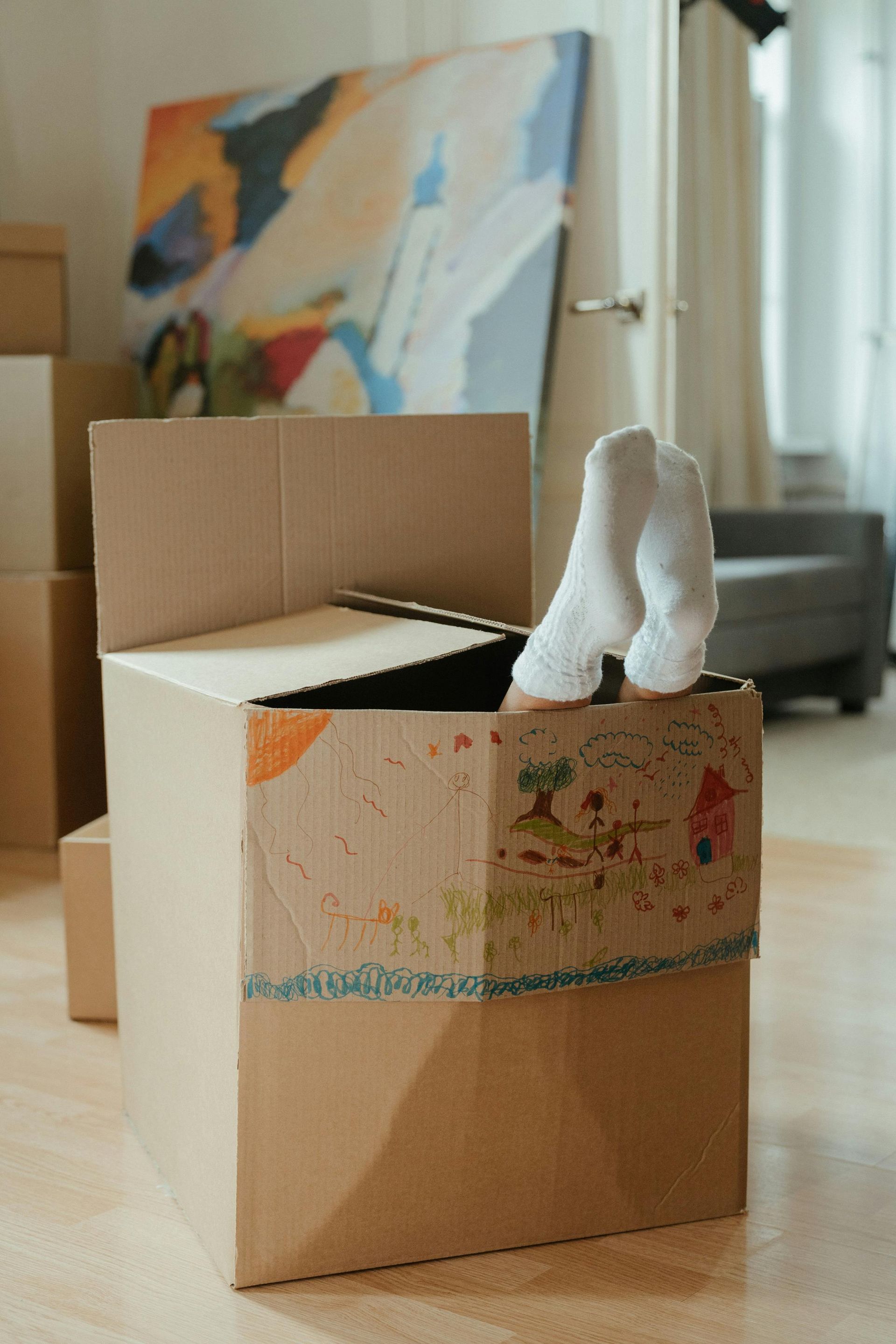 Moving boxes with personal belongings that are often forgotten during relocation