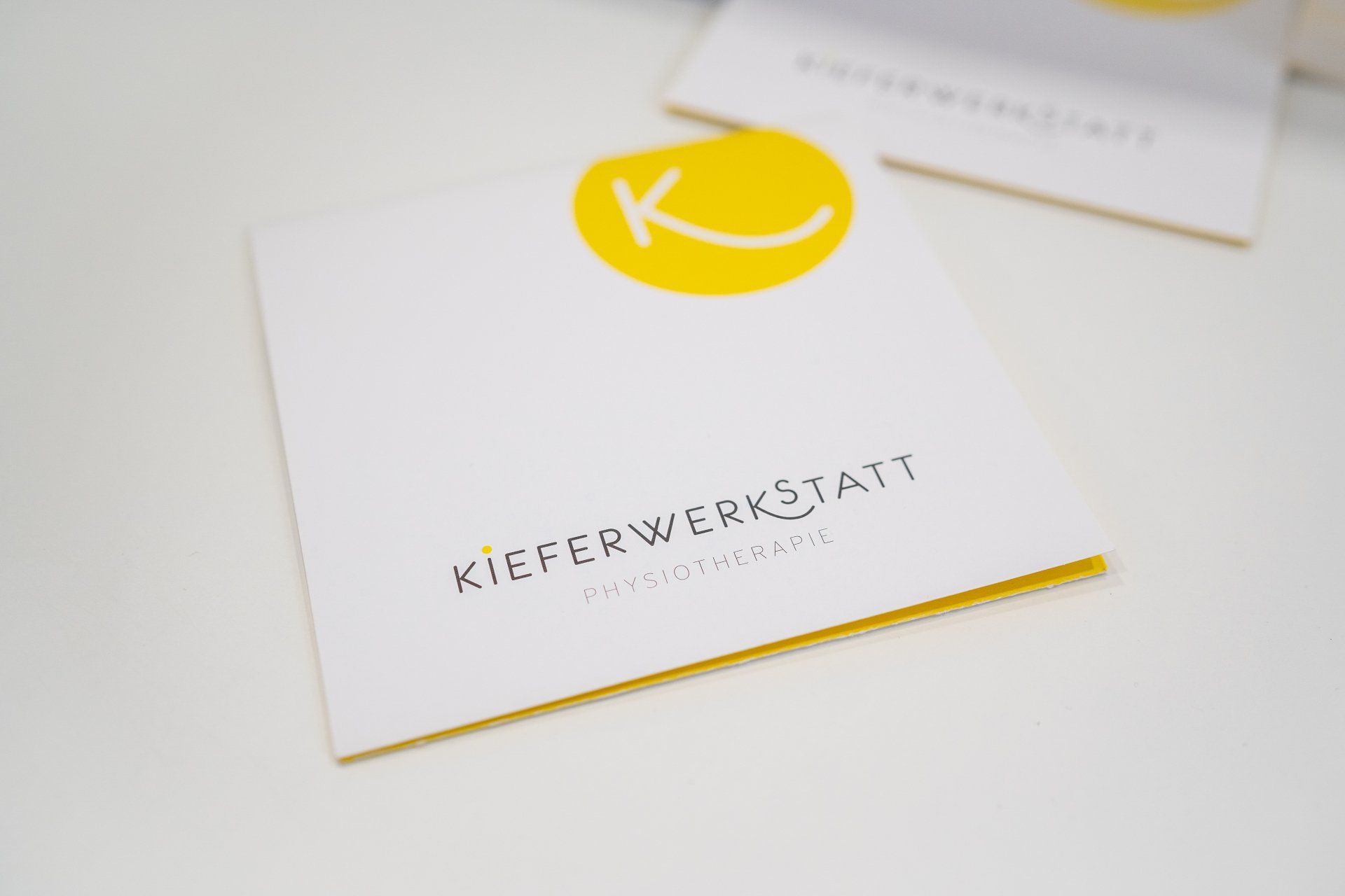 Unser Flyer mit einem gelben K darauf.