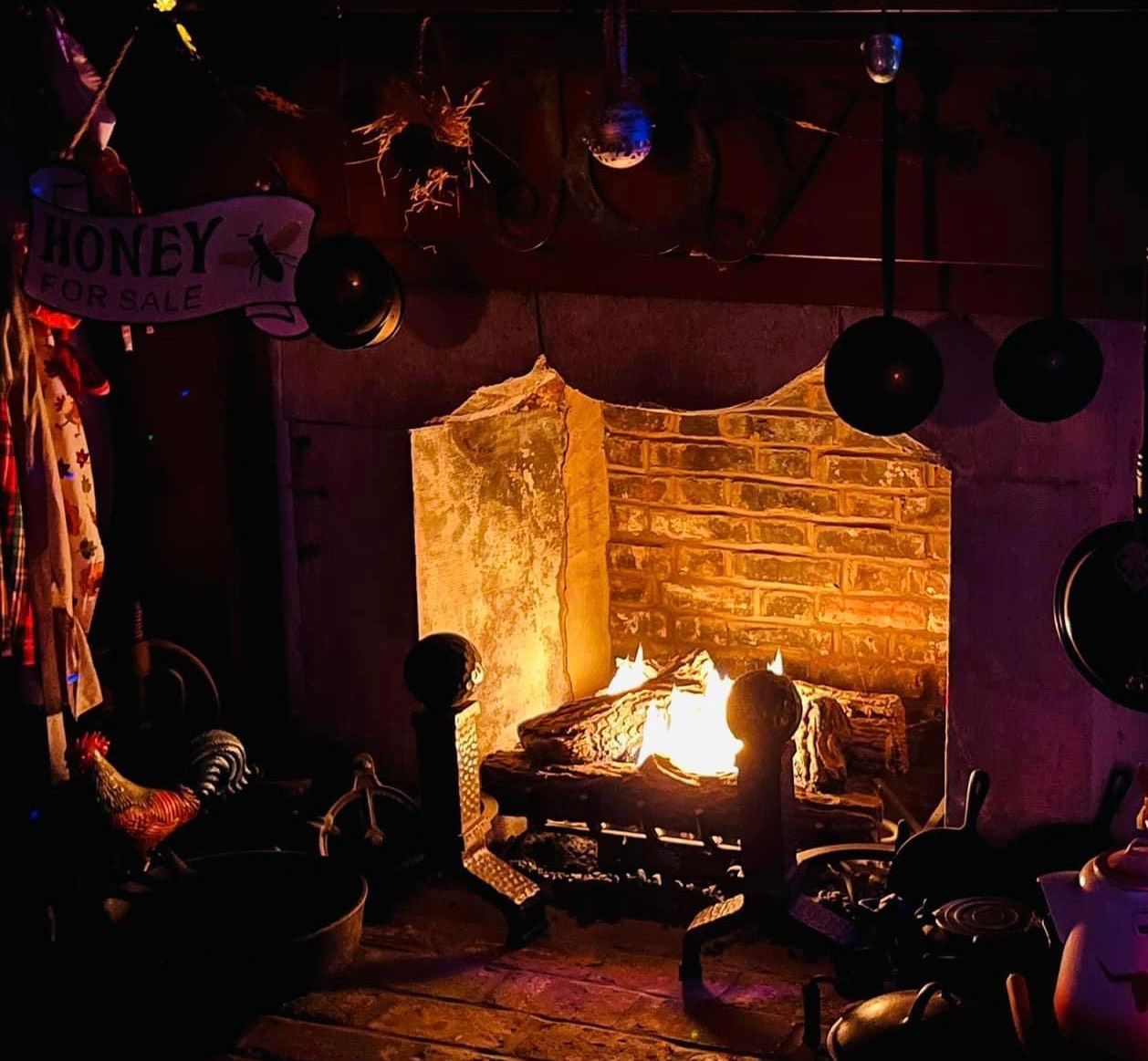 a fireplace with a sign above it that says money