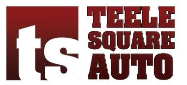 A red and white logo for teele square auto