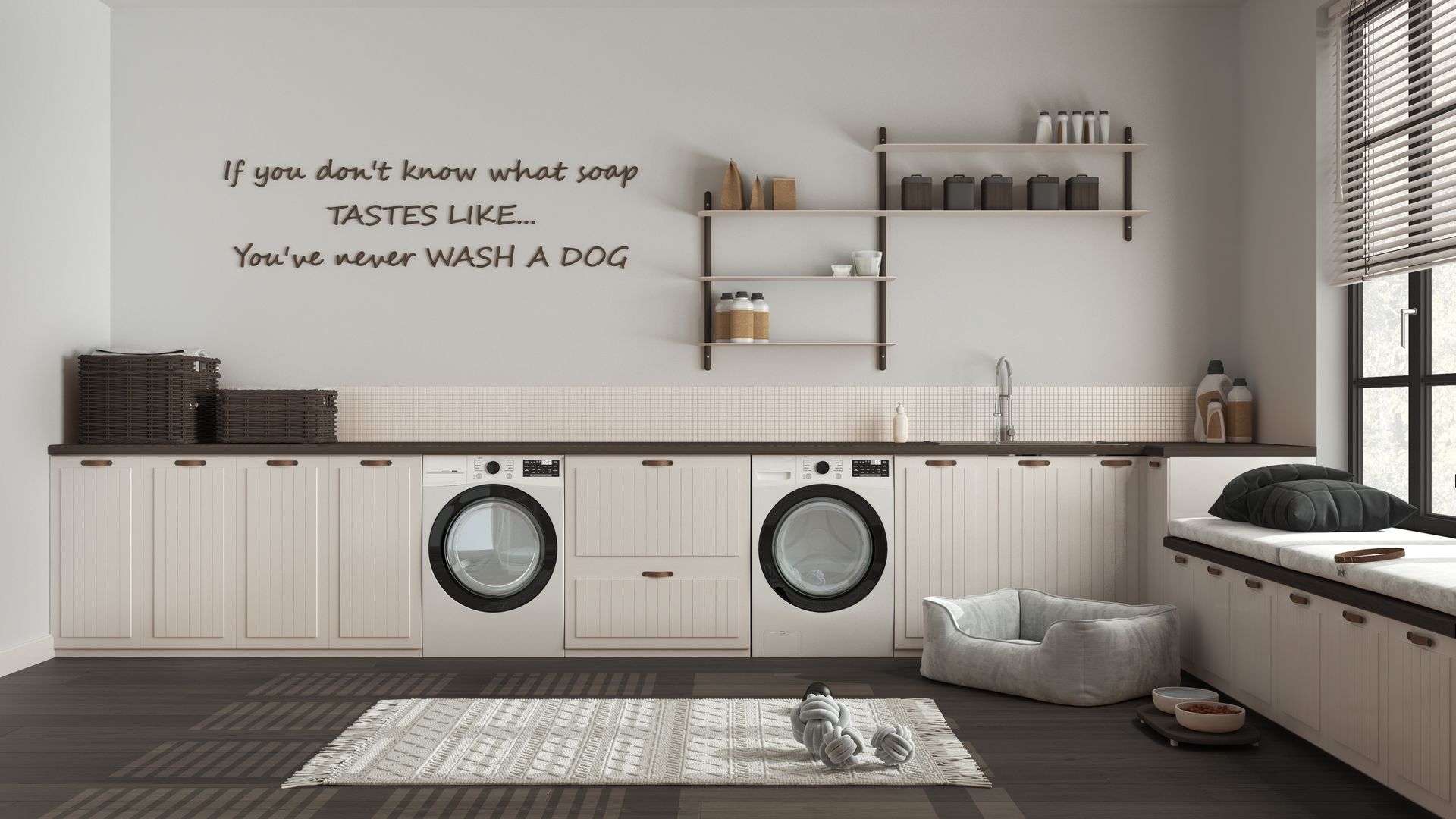 Laundry room with dog washing station. White cabinets, two washing machines, a dog bed, and a wall quote.