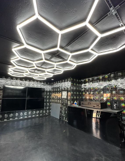 A room with a lot of lights on the ceiling.