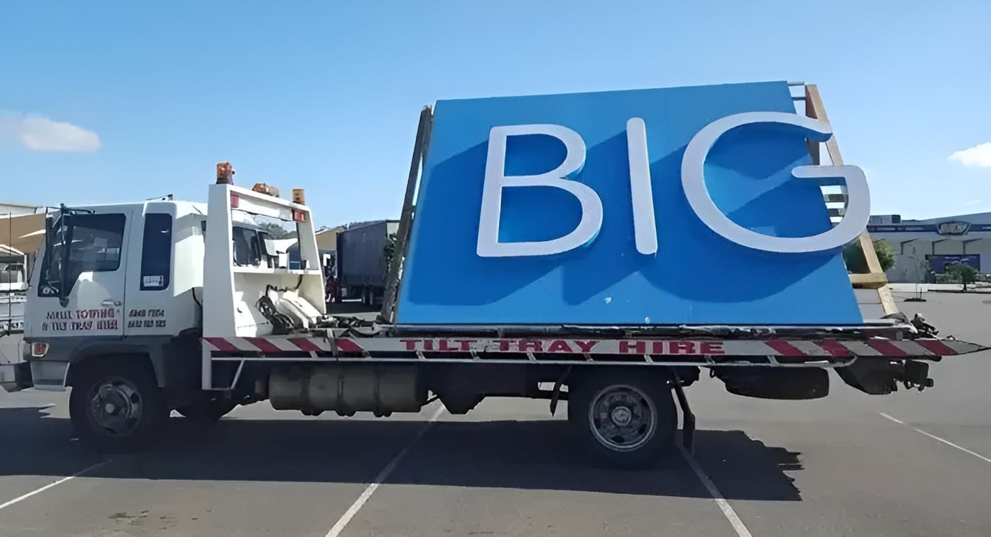 Two Tow Trucks Are Parked Next to Each Other in a Parking Lot — Airlie Towing & Tilt Tray Hire In Cannonvale, QLD