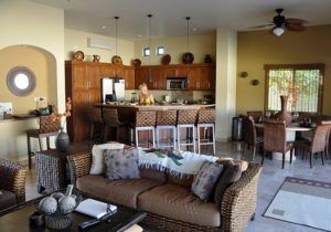 A living room filled with furniture and a kitchen