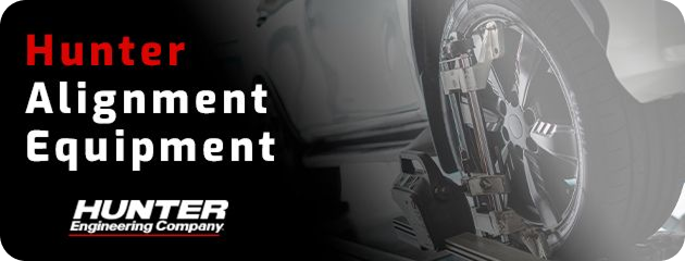 Hunter alignment equipment with a tire in the background. The word "Hunter" is in red. | Zee's Alignment & Autocare
