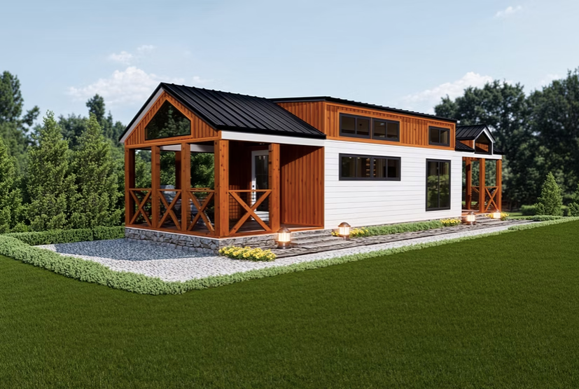 A small house with a porch and a black roof is sitting on top of a lush green field.