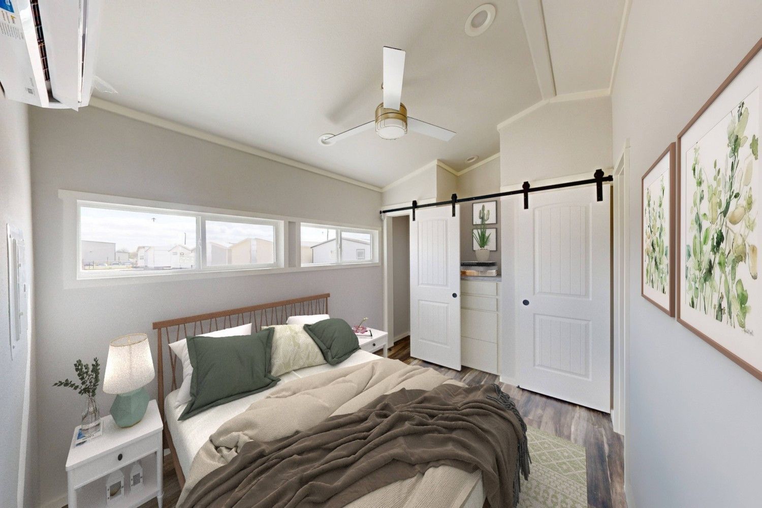 Bedroom with bed, closet, and windows; neutral tones and art on walls.