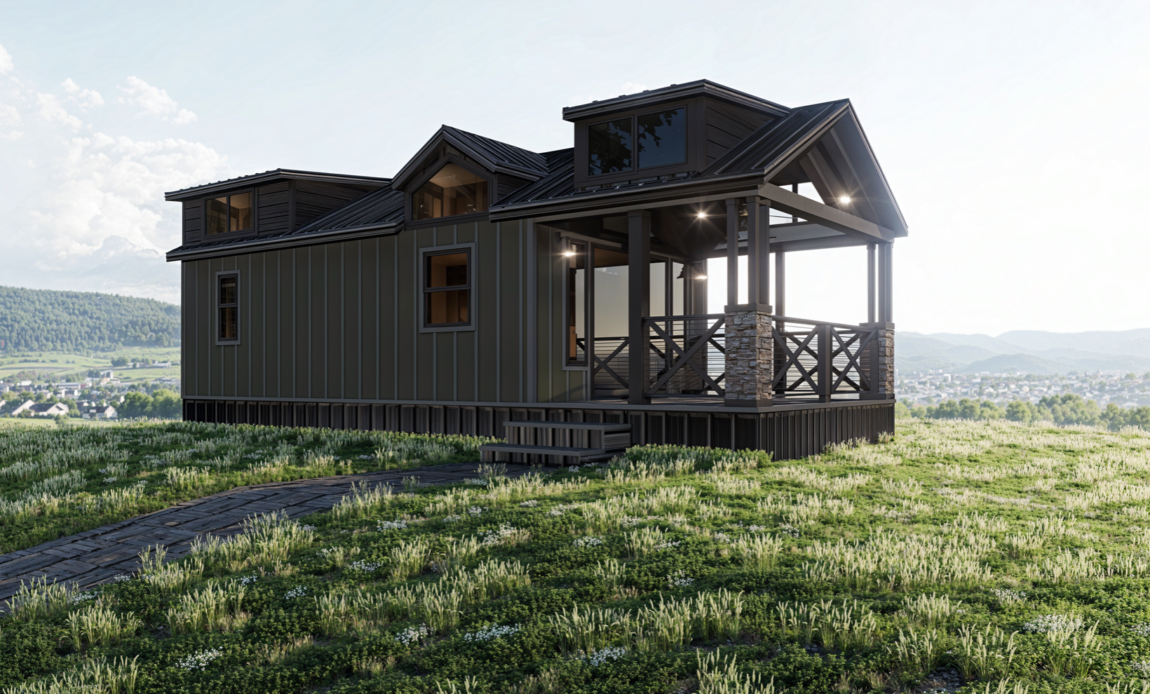 A small house with a porch is sitting on top of a grassy hill.