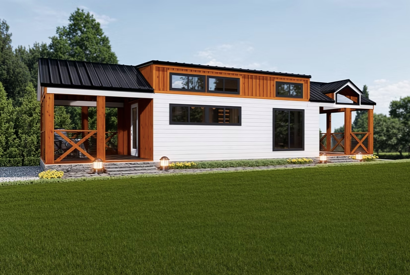 Tiny house with white siding, wooden accents, and a black roof, set on green grass.