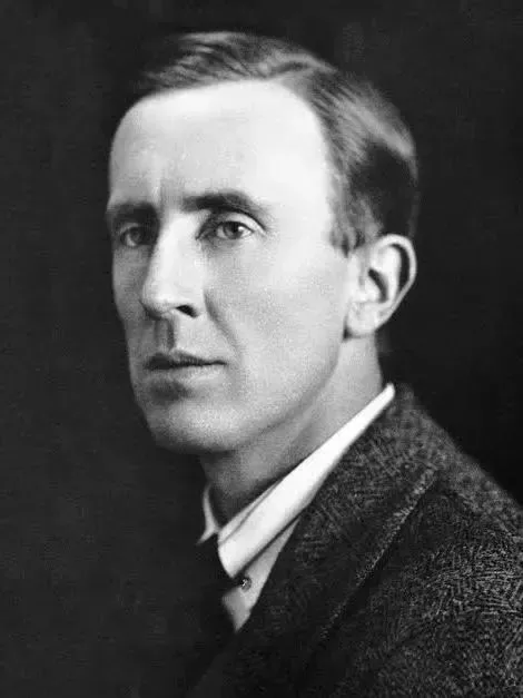 A black-and-white portrait of author J.R.R. Tolkien, shown from the chest up against a dark, plain background - Ashes the Campaign