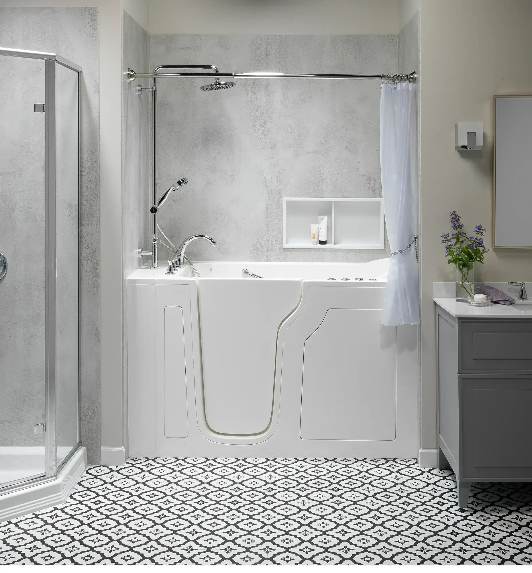 Accessible white bathroom with a walk-in tub, glass shower, and patterned black-and-white tile floor