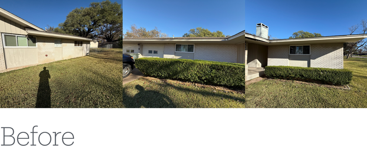 Exterior view of a house before work is done; concrete walls, green lawn, blue sky.