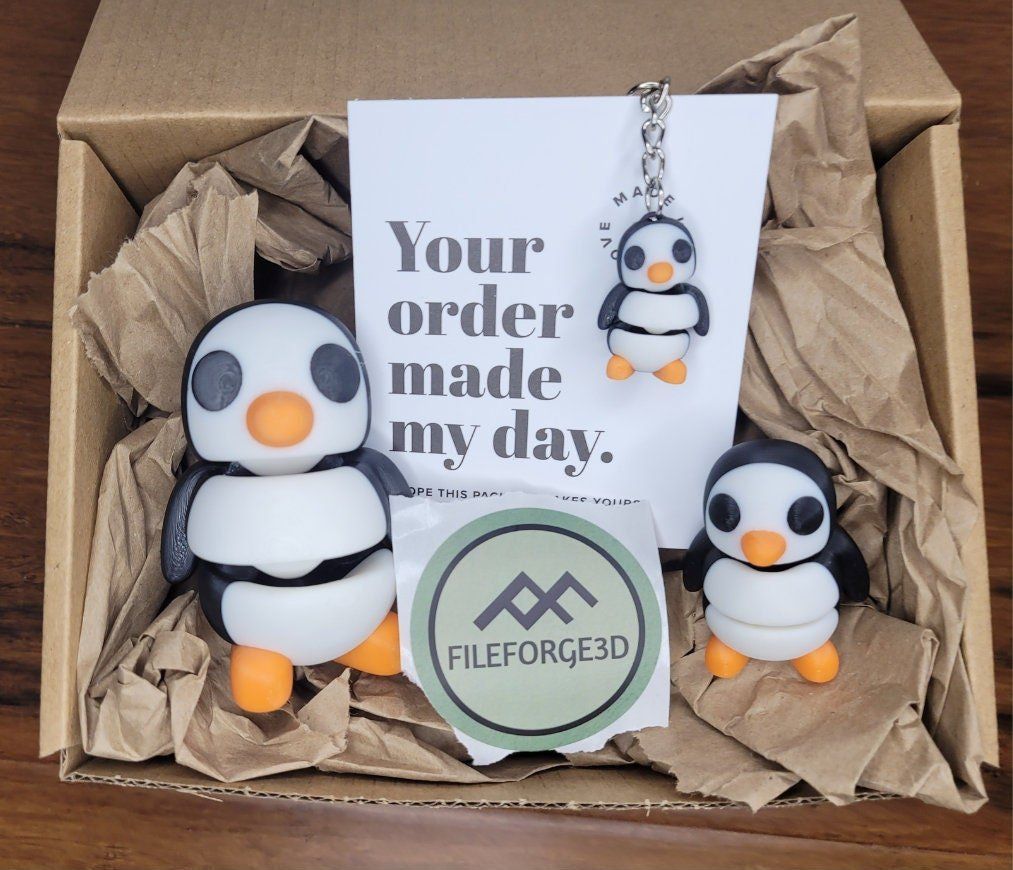 A box with penguins and a card that says your order made my day