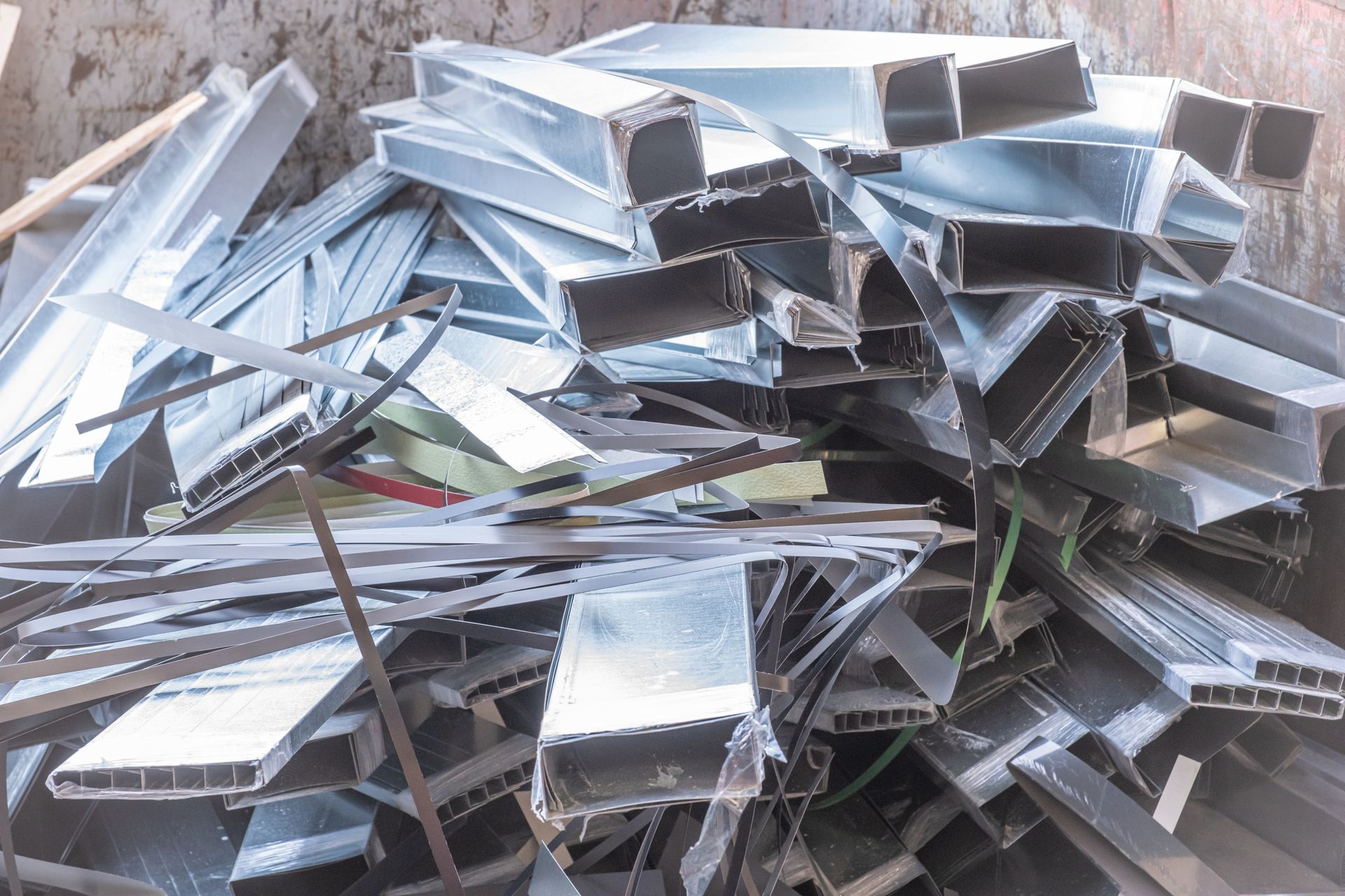 Representing scrap metal recycling with piles of scrap ready for collection and processing.