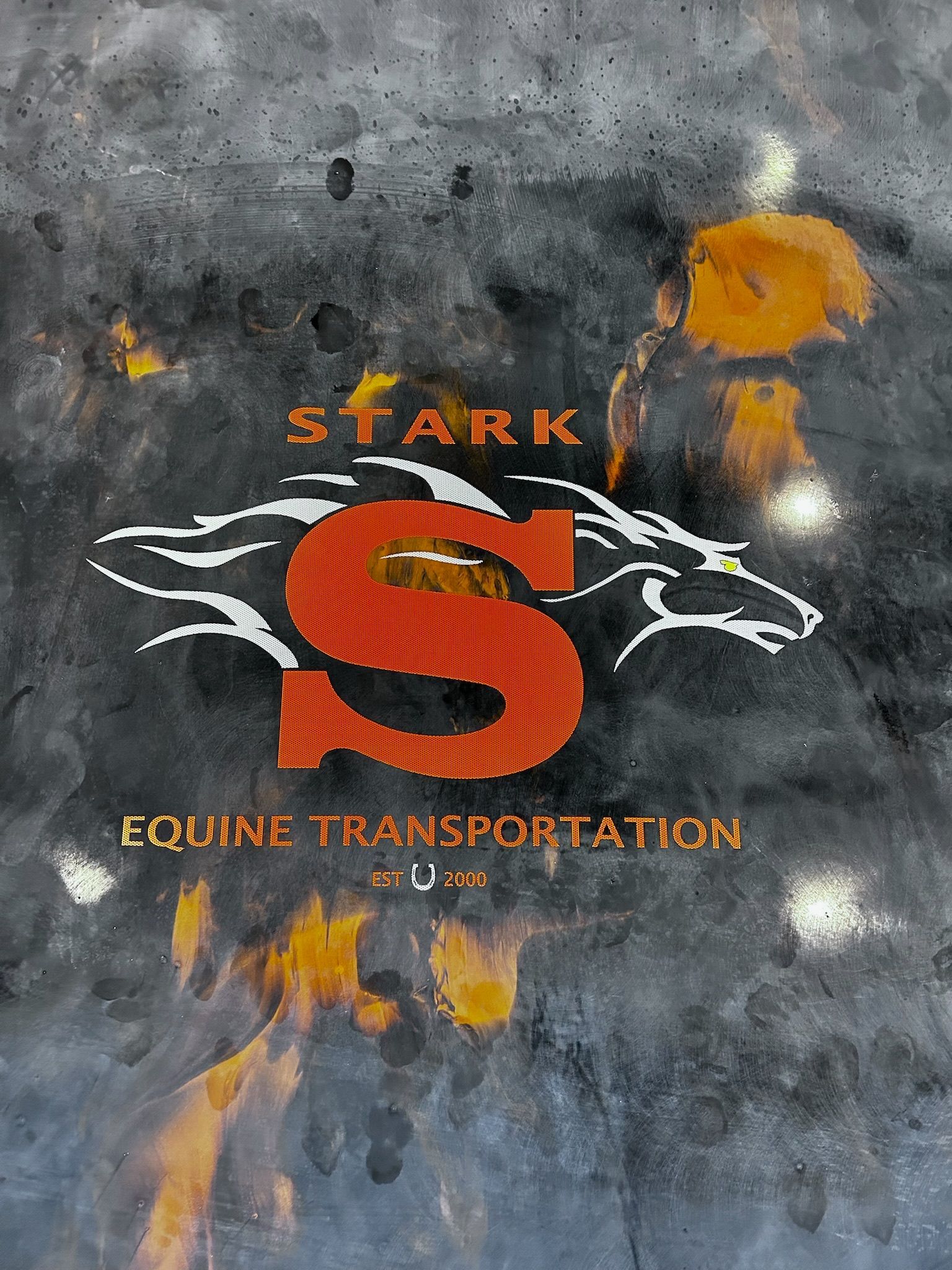 Logo for Stark Equine Transportation: orange