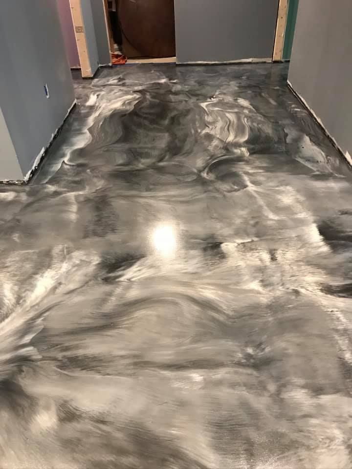 Gray and silver epoxy floor in a hallway.