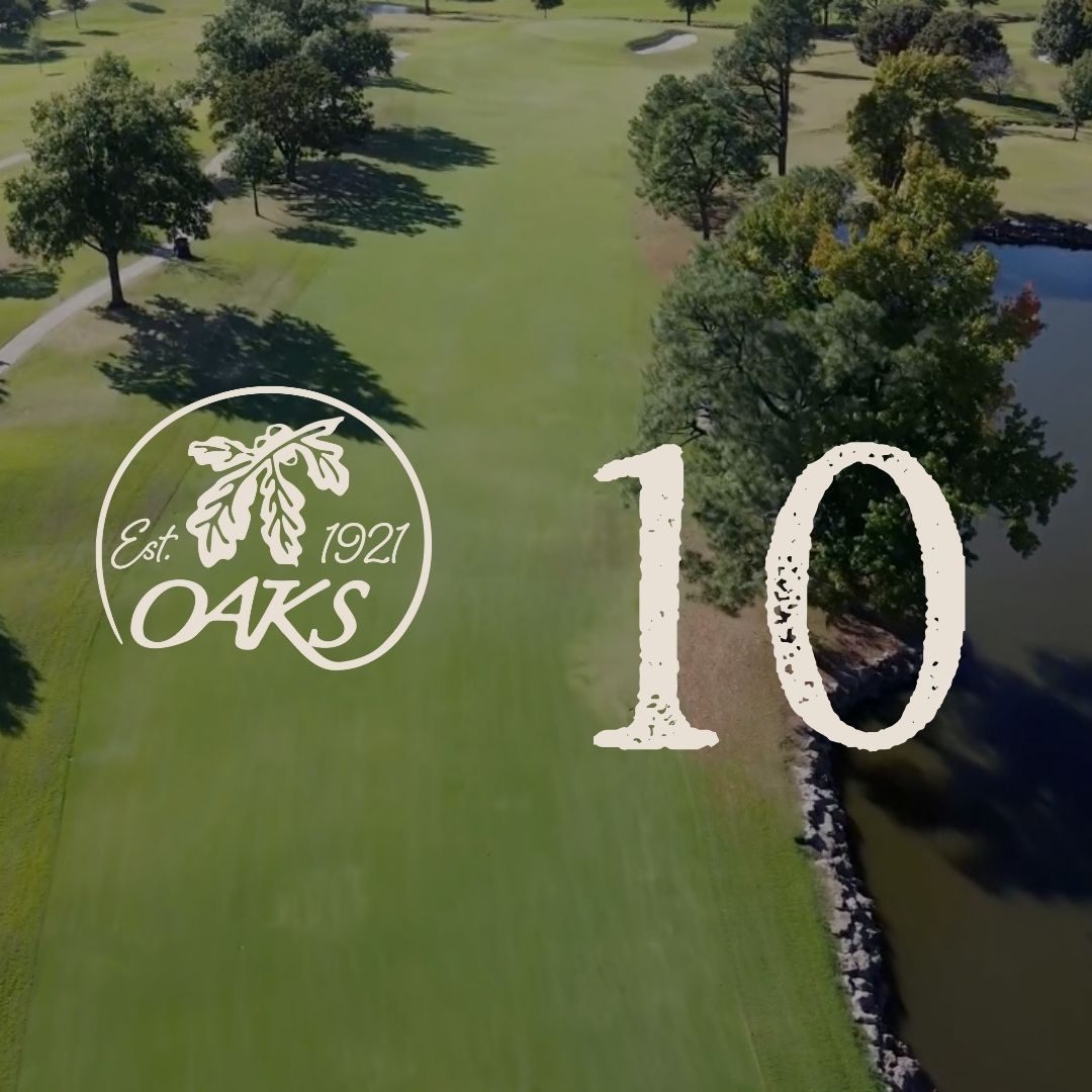 Golf course hole 10 at Oaks, with logo. Green fairway beside water and trees.