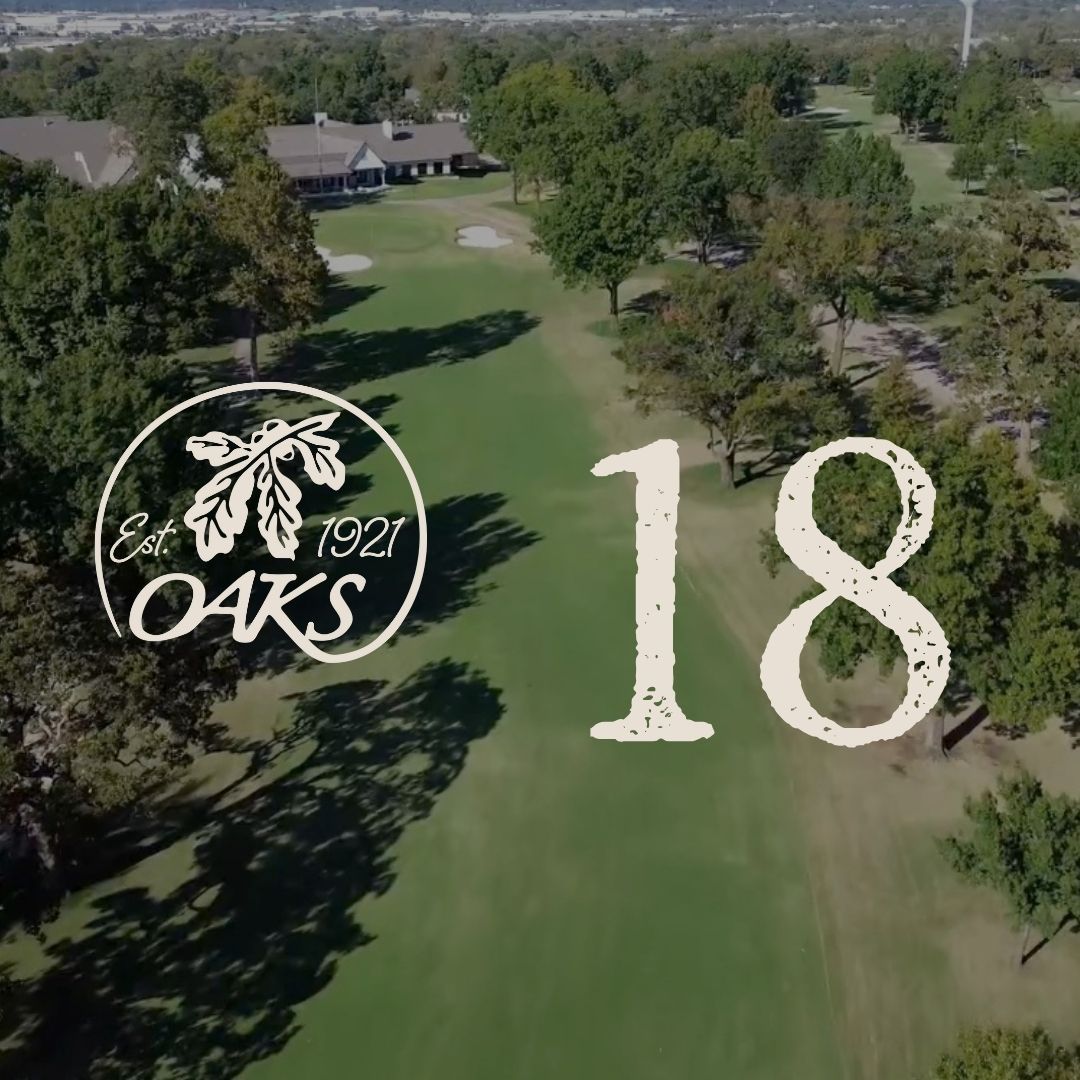 Aerial view of a green golf course with the number 18 and an Oaks logo. Trees line the course.