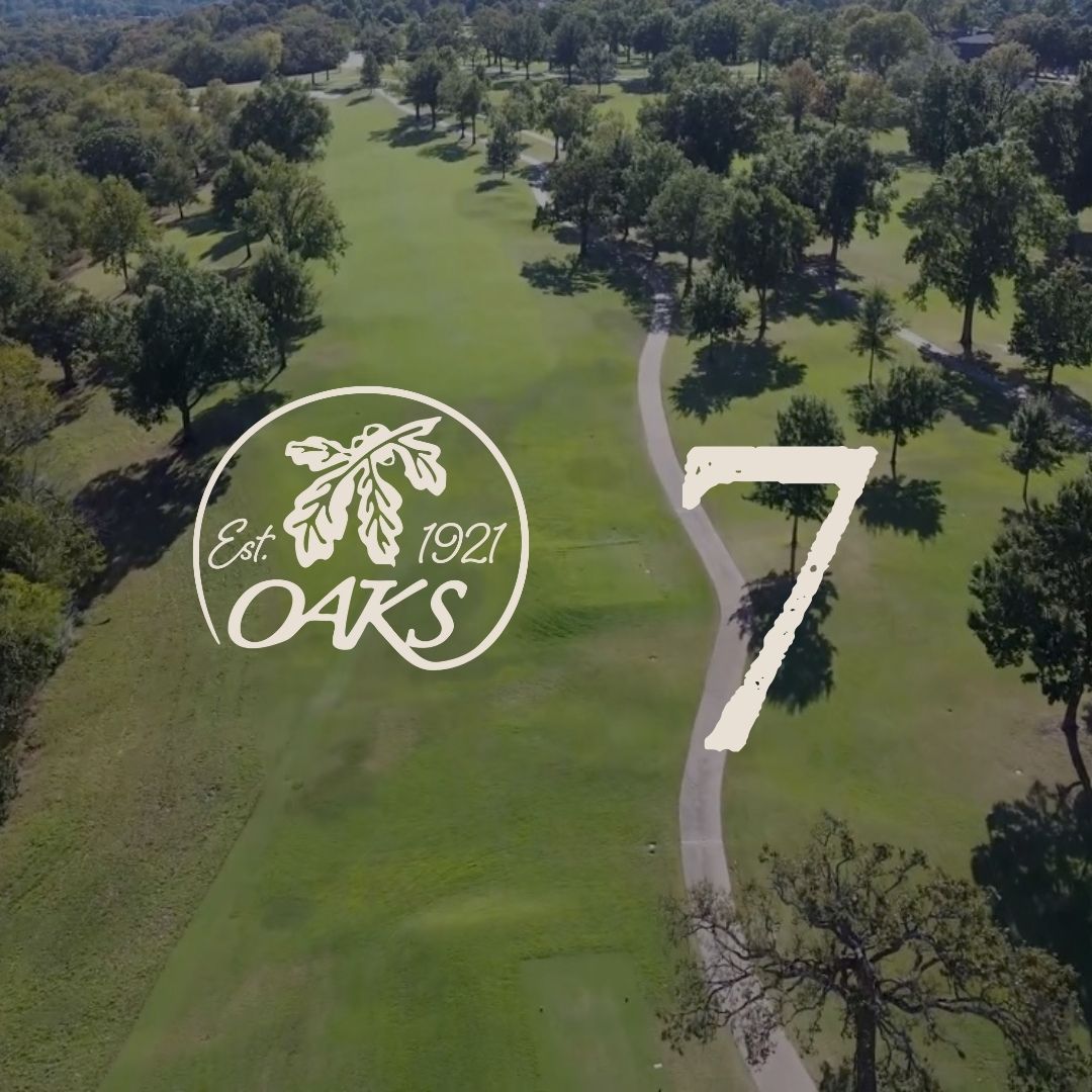 Golf course with the Oaks logo and number 7 overlaid on the fairway.