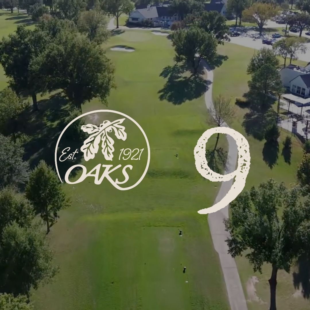 Aerial view of a green golf course with the