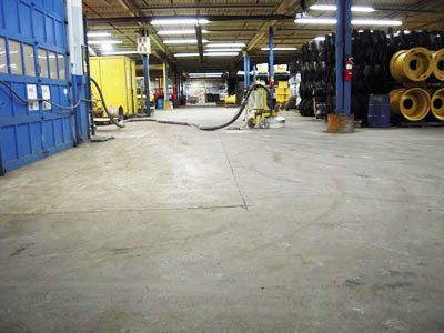 A large warehouse with a lot of tires on the floor
