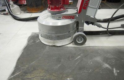 A machine is being used to polish a concrete floor.